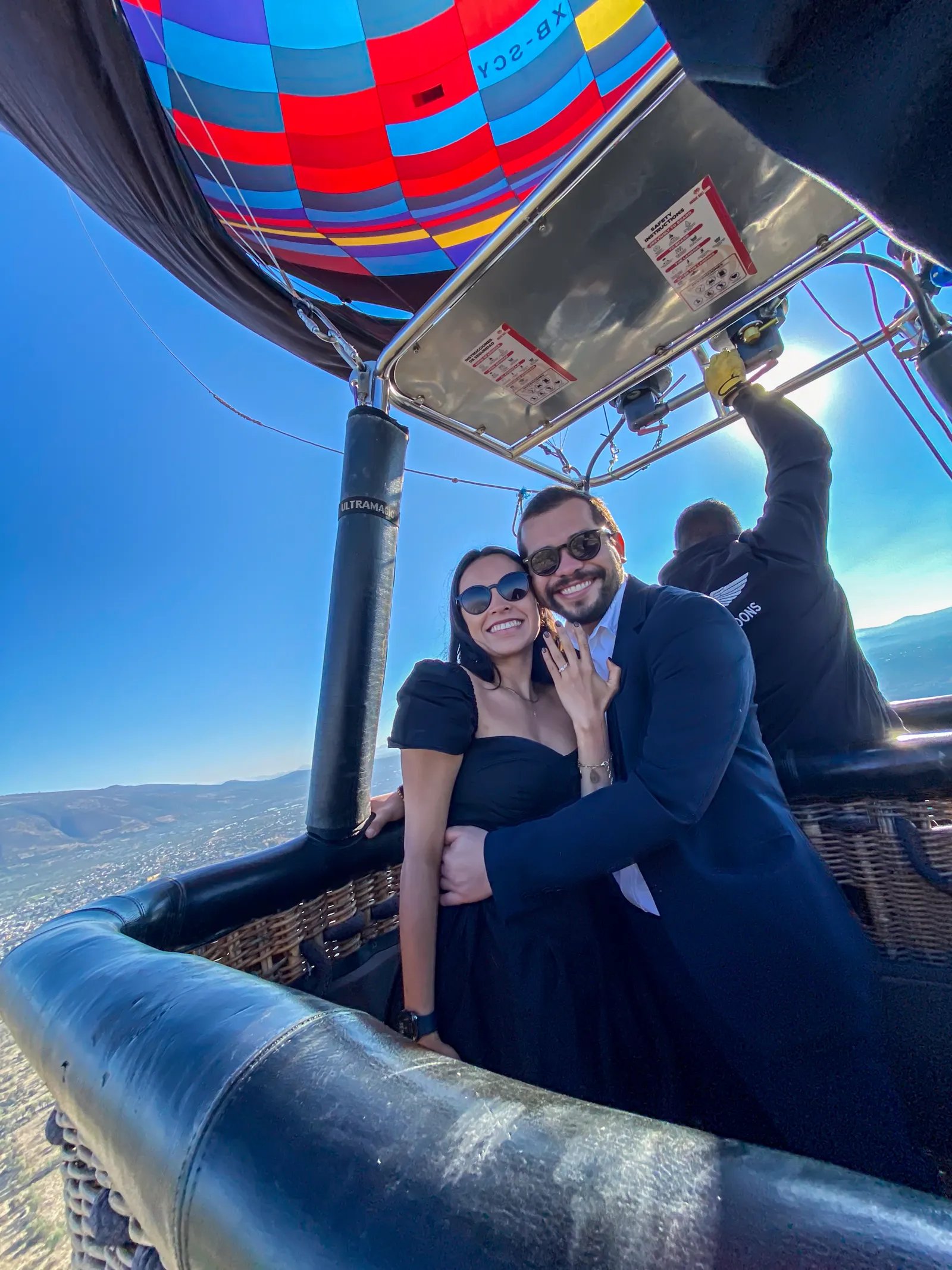Couple embracing on a private flight